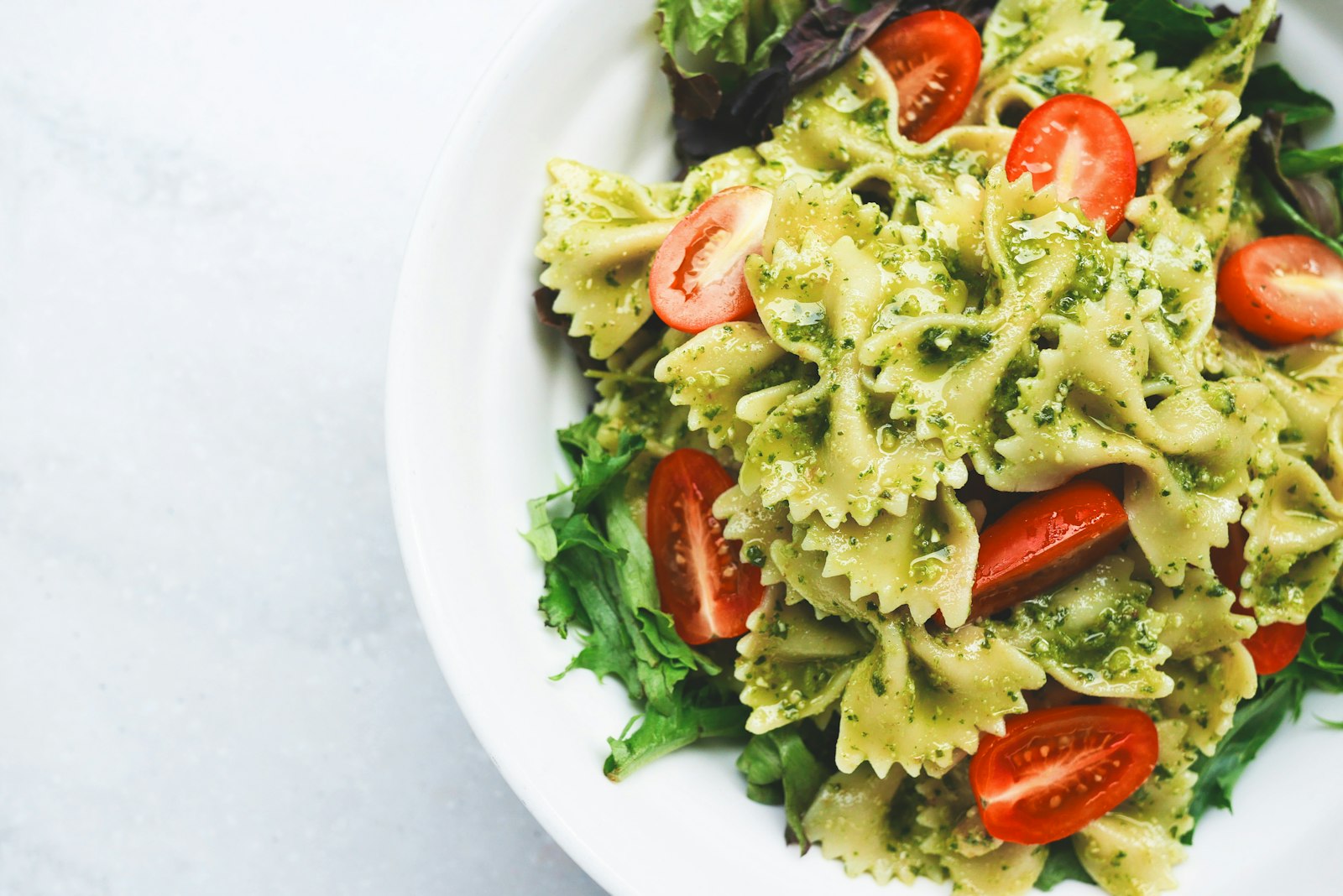 Pesto farfalle with blistered tomatoes